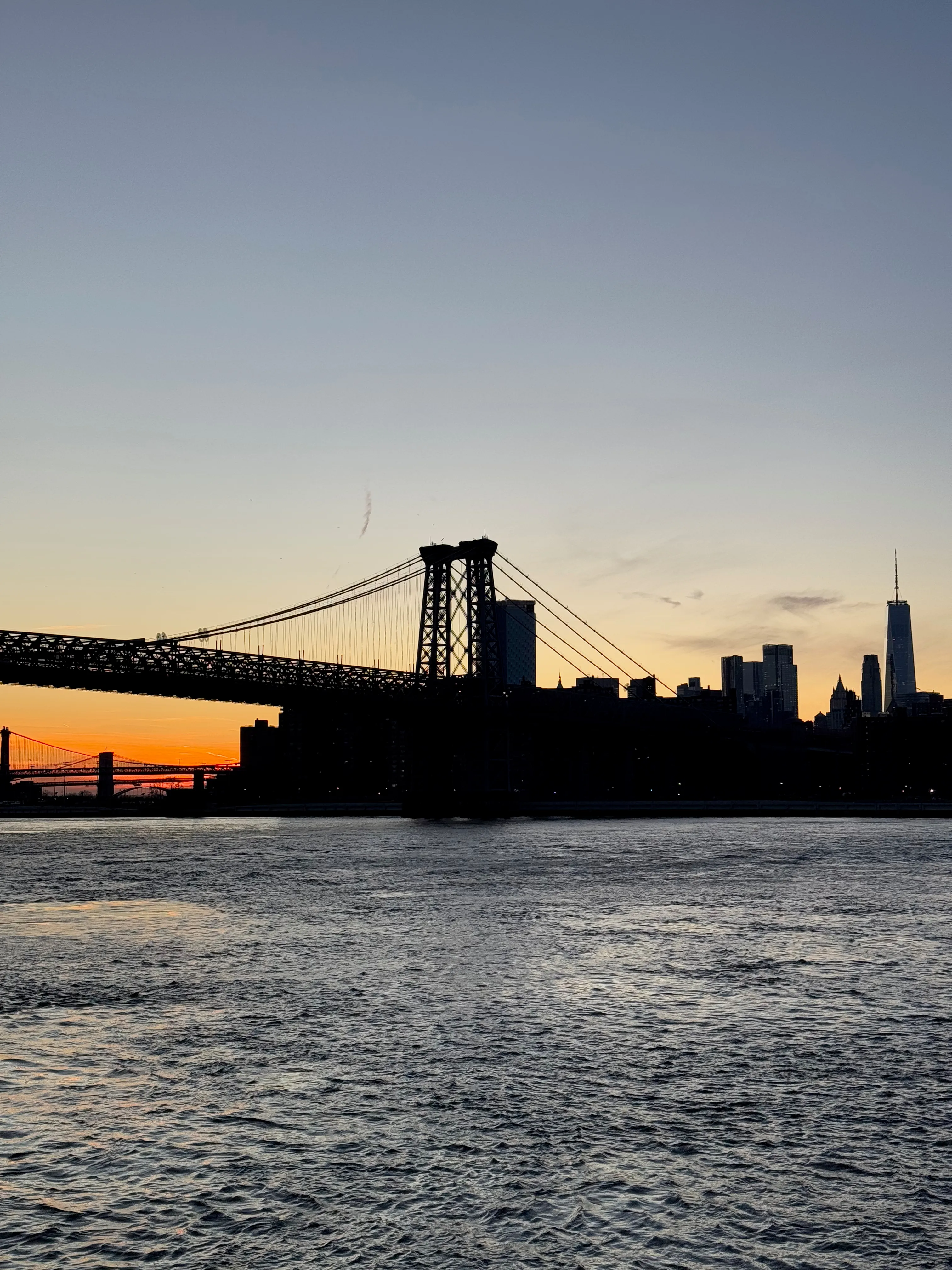 Photo of the Manhattan Bridge with the sunset in the background
