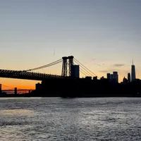 Photo of the Manhattan Bridge with the sunset in the background