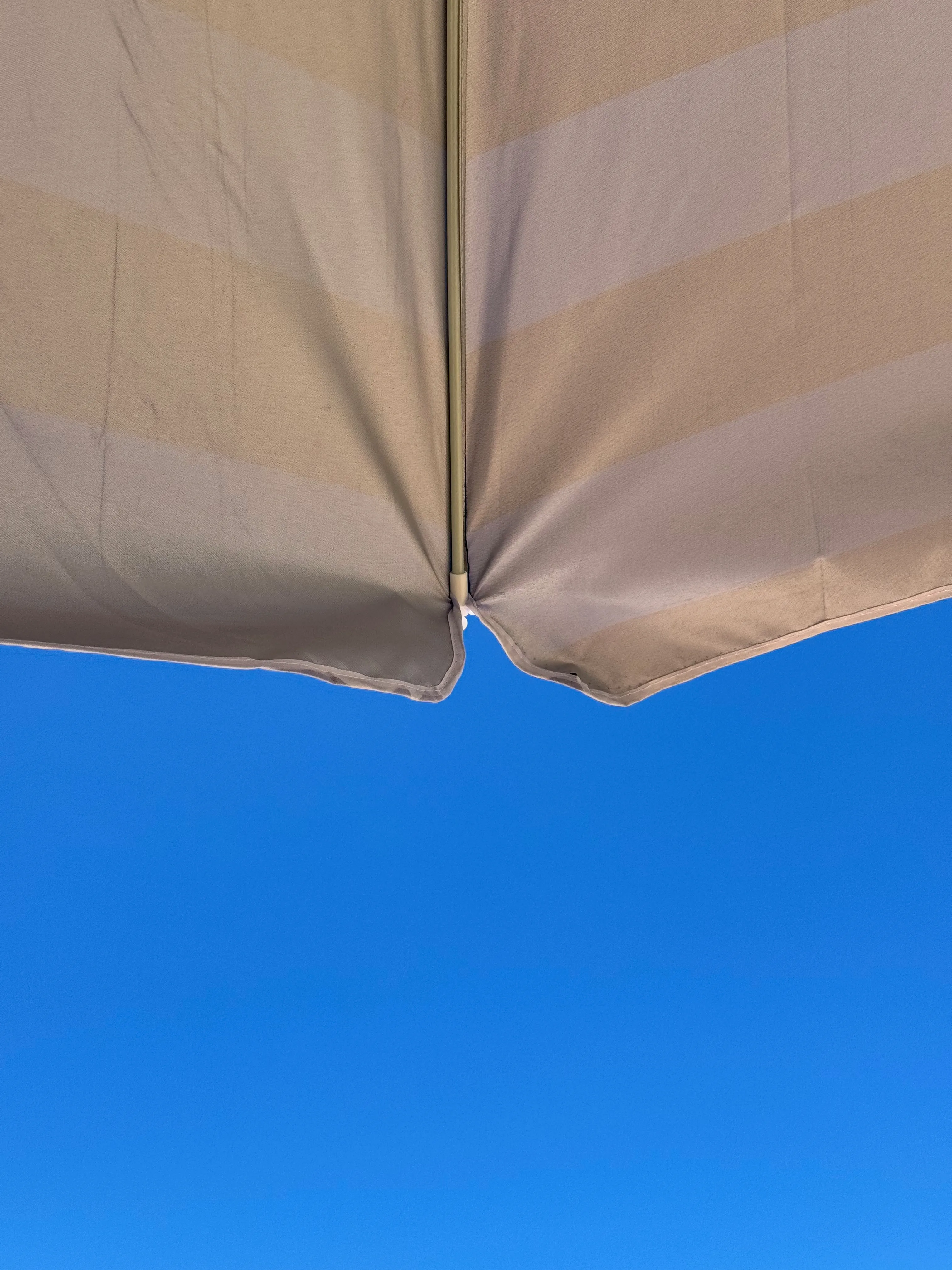 Photo of a beach umbrella from below