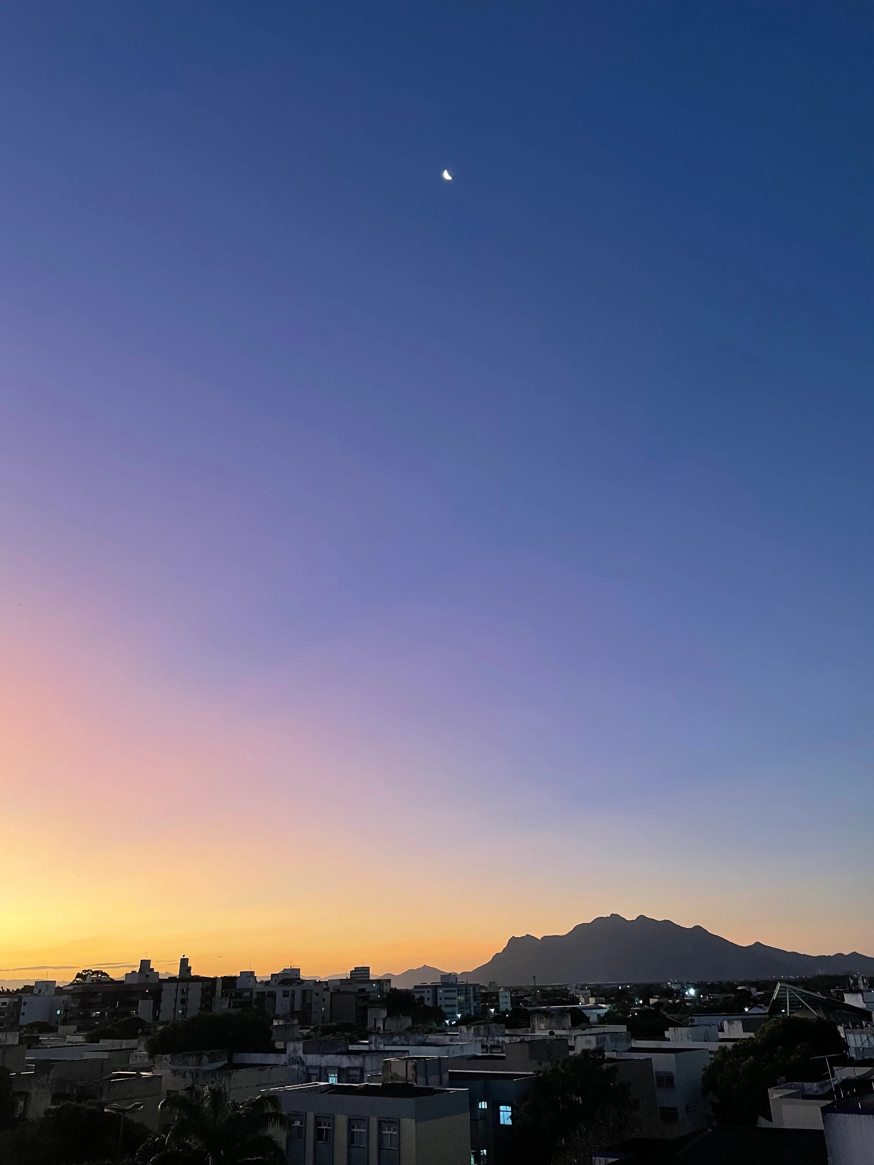 Photo of the sunset and the moon from my apartment