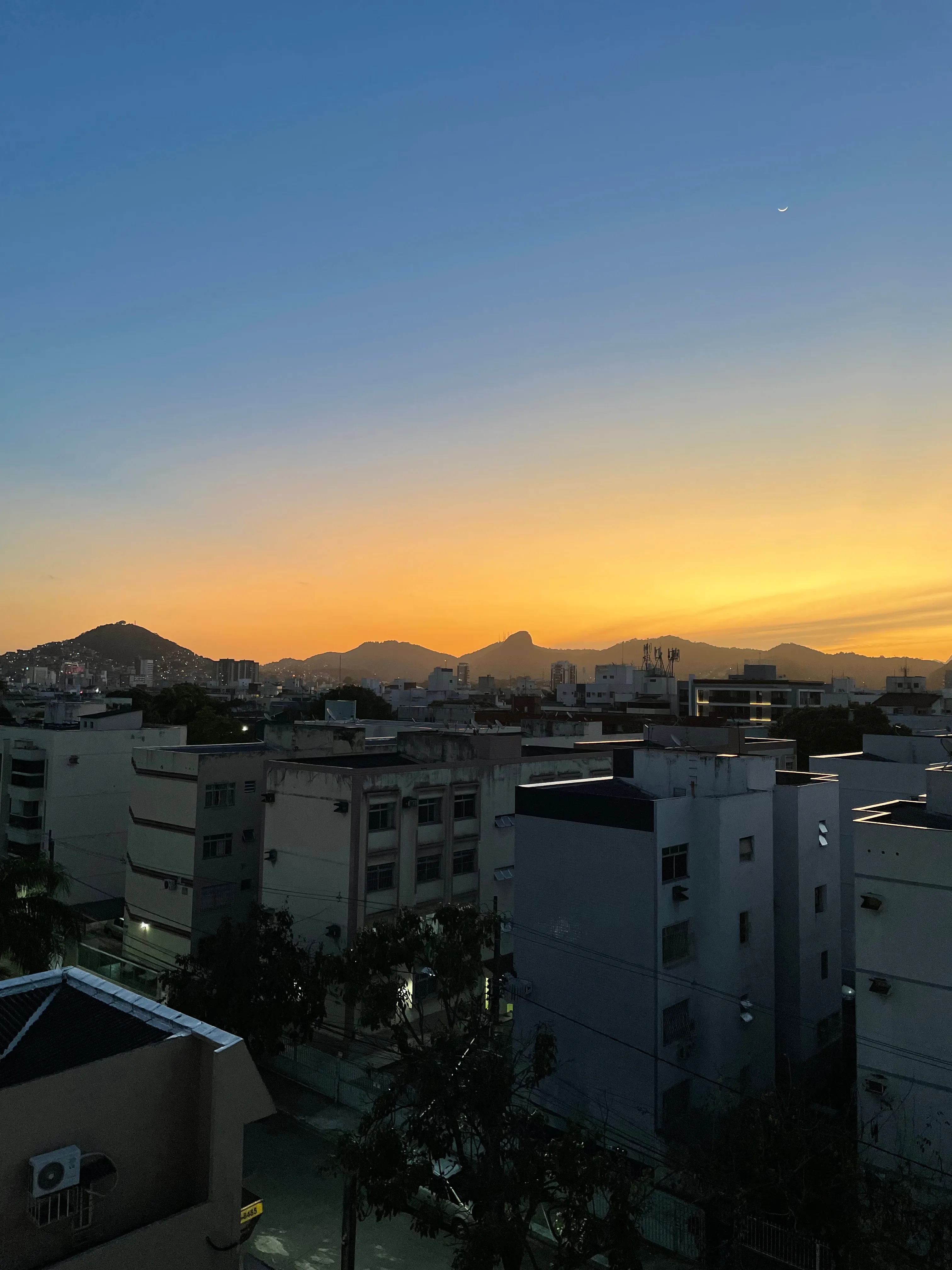 Photo of a sunset over the mountains from my apartment