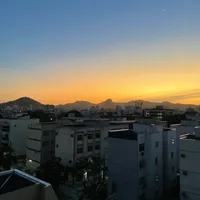 Photo of a sunset over the mountains from my apartment