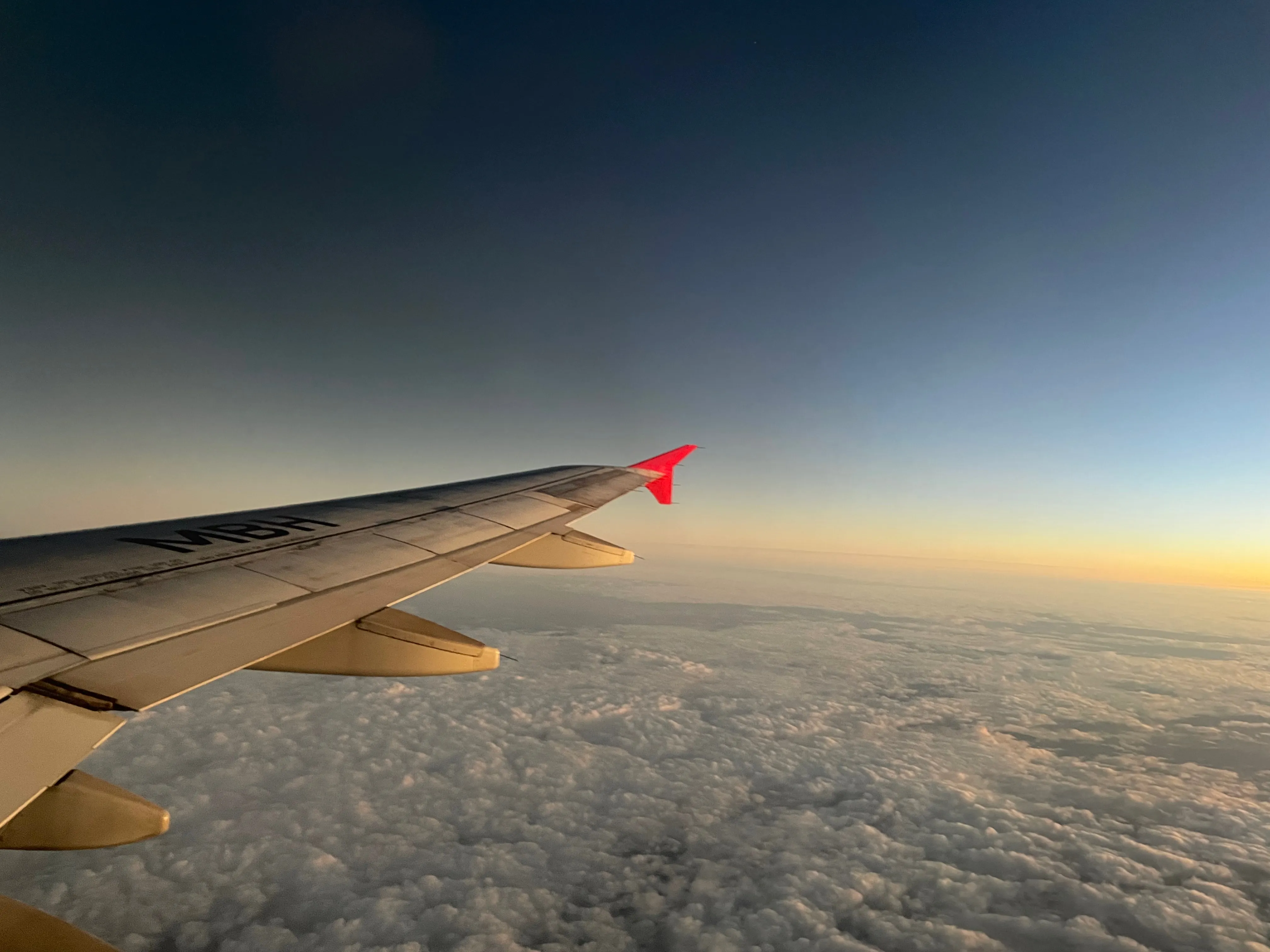 Photo of the tip of the wing of a plane